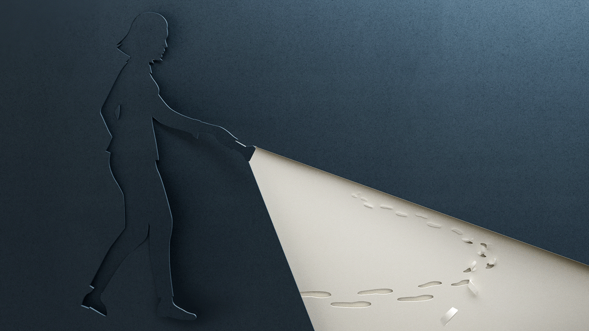 Paper-cut figure following an illuminated path