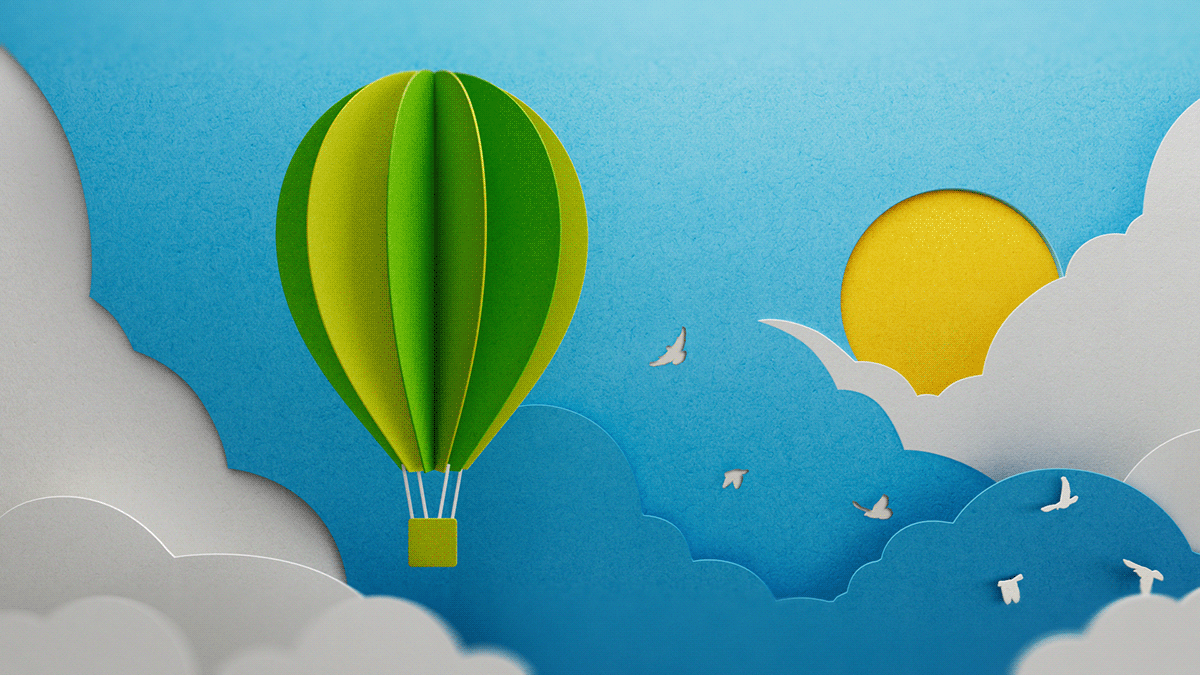 Paper-crafted balloon above clouds